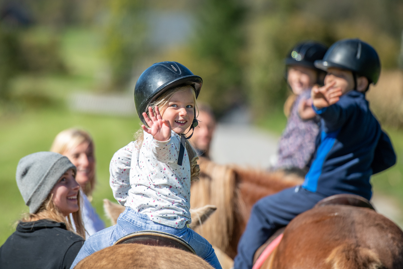 Children training horseback riding